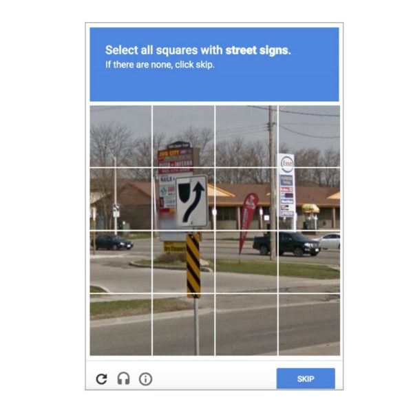 example of how to deter a type of spam that attacks websites a recaptcha image asking user to "select all squares with street signs"